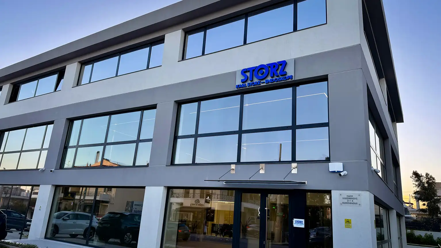 Modern office building with STORZ company sign above the main entrance.
