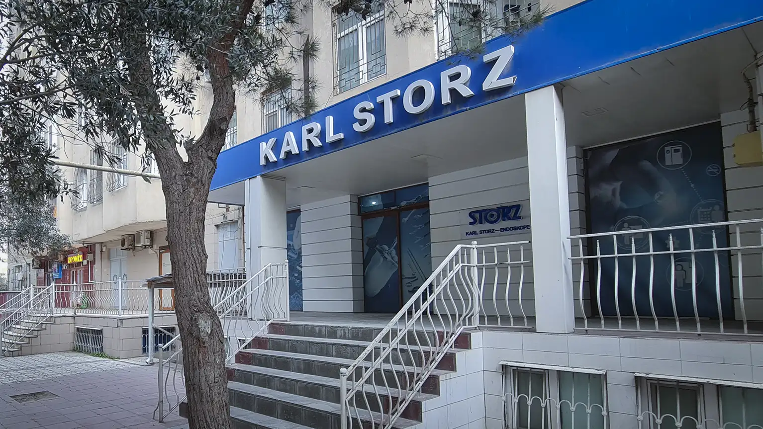 Entrance of the KARL STORZ medical equipment store with a blue sign above the door.