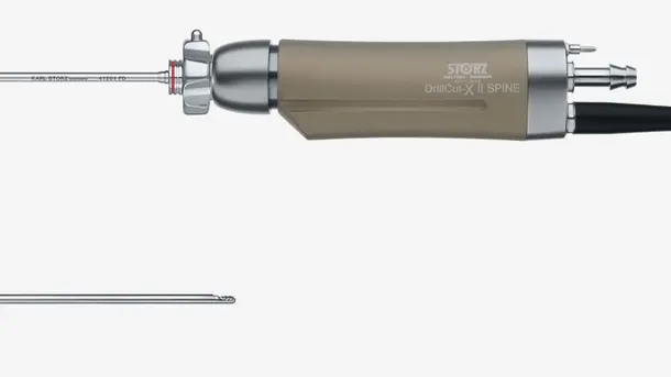 Spinal surgical drill with long, thin attachment for minimally invasive spine procedures.