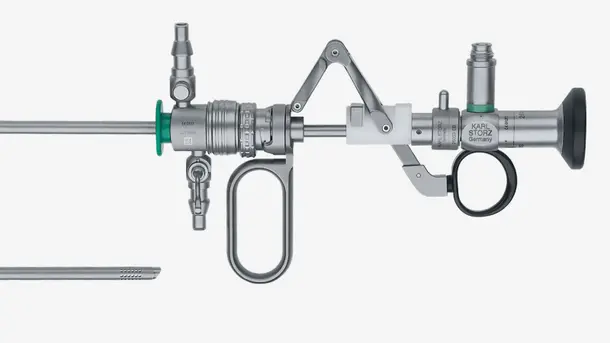 Rigid medical endoscope device with metallic components and precision adjustment knobs.