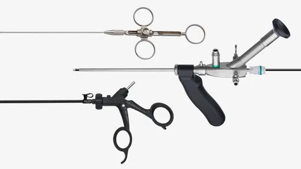Three different endoscopy instruments, including a rigid endoscope and surgical forceps, arranged on a white background.