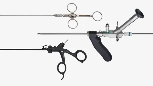 Three different types of endoscopic surgical instruments used for minimally invasive medical procedures.
