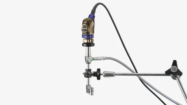 Medical endoscope device with camera and attached cables for minimally invasive surgeries.