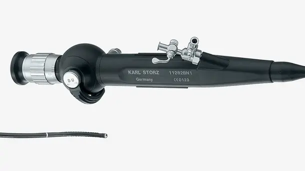 Flexible endoscope medical instrument with eyepiece and control valves.