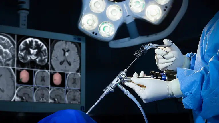 Surgeon performing minimally invasive brain surgery using advanced surgical instruments.
