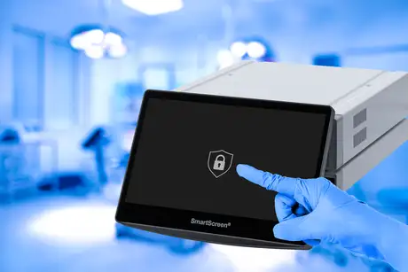 Gloved hand touching a secure login screen on a medical touchscreen device.
