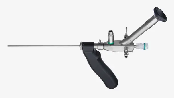 Rigid endoscope medical instrument with handle and eyepiece.