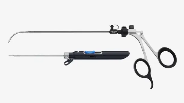 Two surgical endoscopy instruments with ergonomic handles and long, thin shafts.