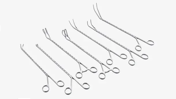 Set of long metal surgical forceps with different angled tips arranged side by side.