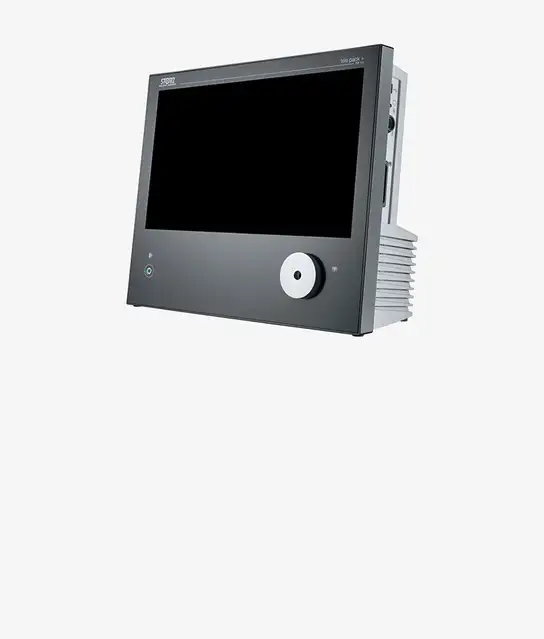 Modern medical monitor device with a large display and control knob.