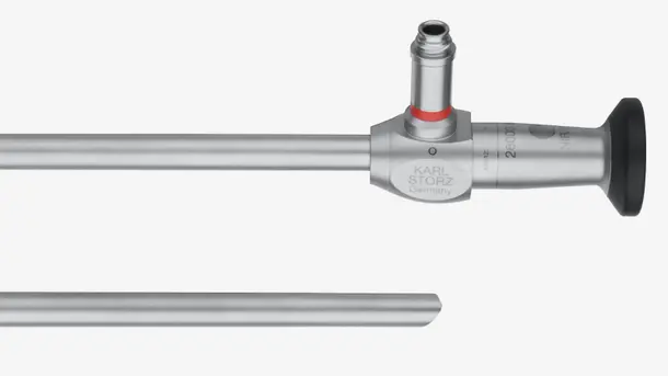 Rigid endoscope for medical procedures, shown in close-up with visible lens and metallic shaft.
