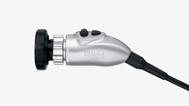 Medical endoscope camera head with control buttons, shown in side view.
