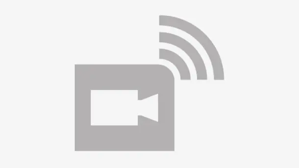 Video camera icon with wireless signal symbol.