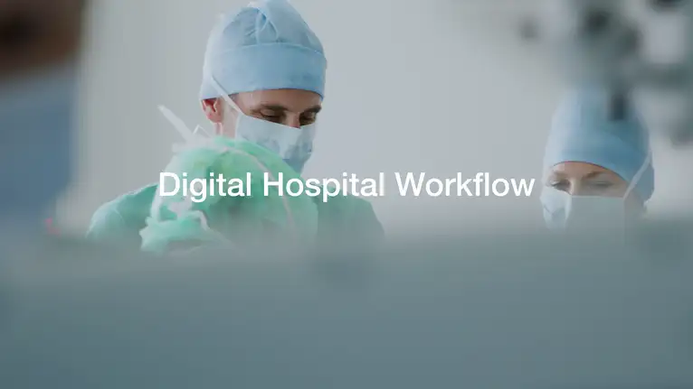 Medical staff in surgical attire performing a procedure, highlighting digital hospital workflow.