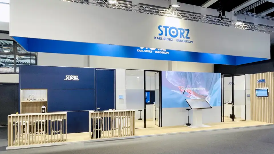Trade show booth for KARL STORZ featuring digital hospital workflow display and branded signage.