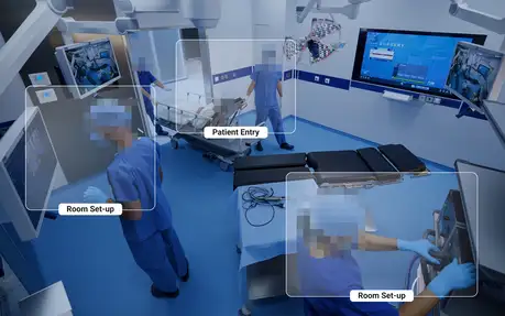 Medical staff in blue scrubs prepare an operating room with high-tech equipment for surgery.