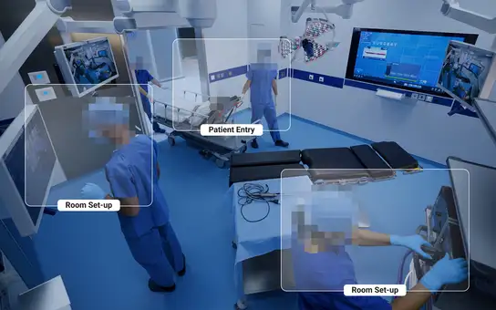Medical staff preparing an operating room and transporting a patient on a stretcher.