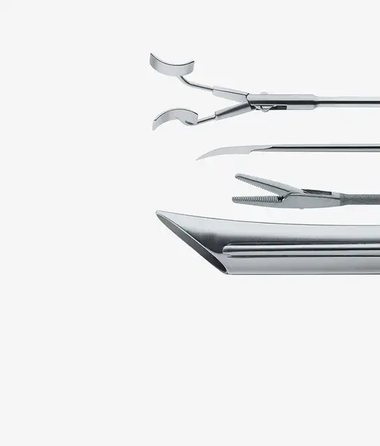 Four stainless steel surgical instruments arranged horizontally.