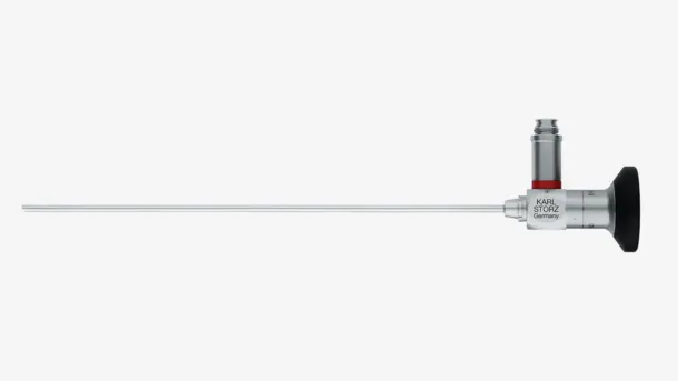 Rigid endoscope medical instrument with black eyepiece and long silver shaft.